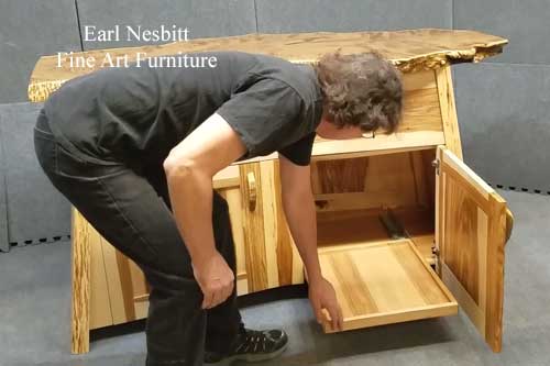 opens other lower pull out tray opens other lower pull out tray